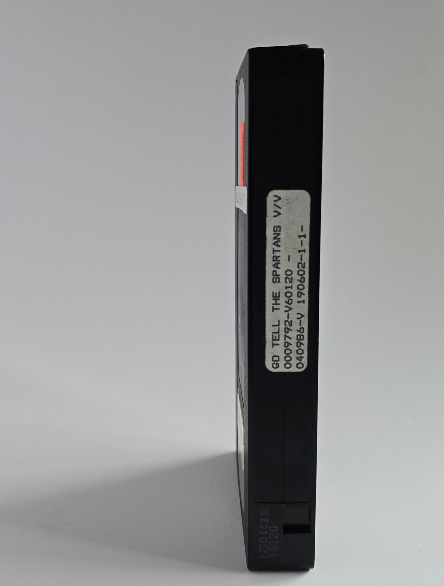 Go Tell the Spartans cassette spine with missing sticker.