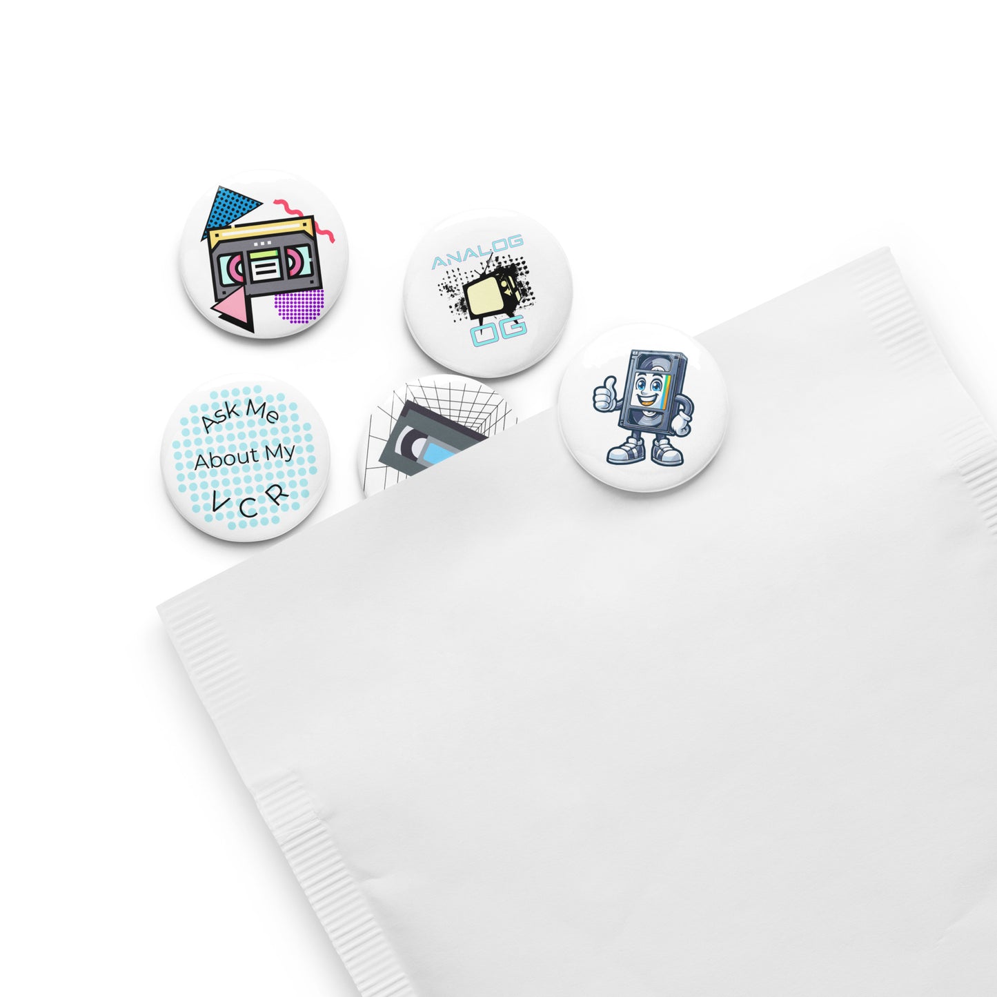 Set of 5 pin buttons with various vhs themed images on them