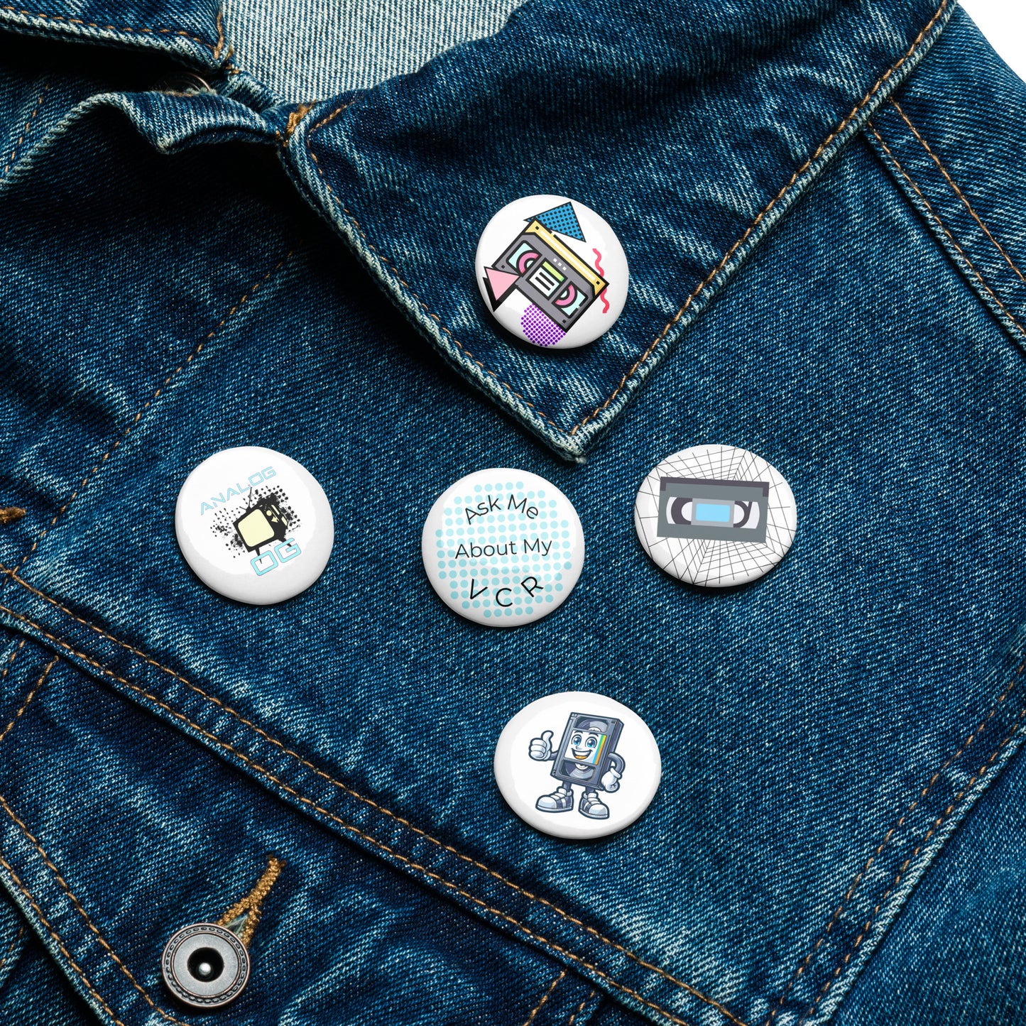 Set of 5 pin buttons with various vhs themed images on them