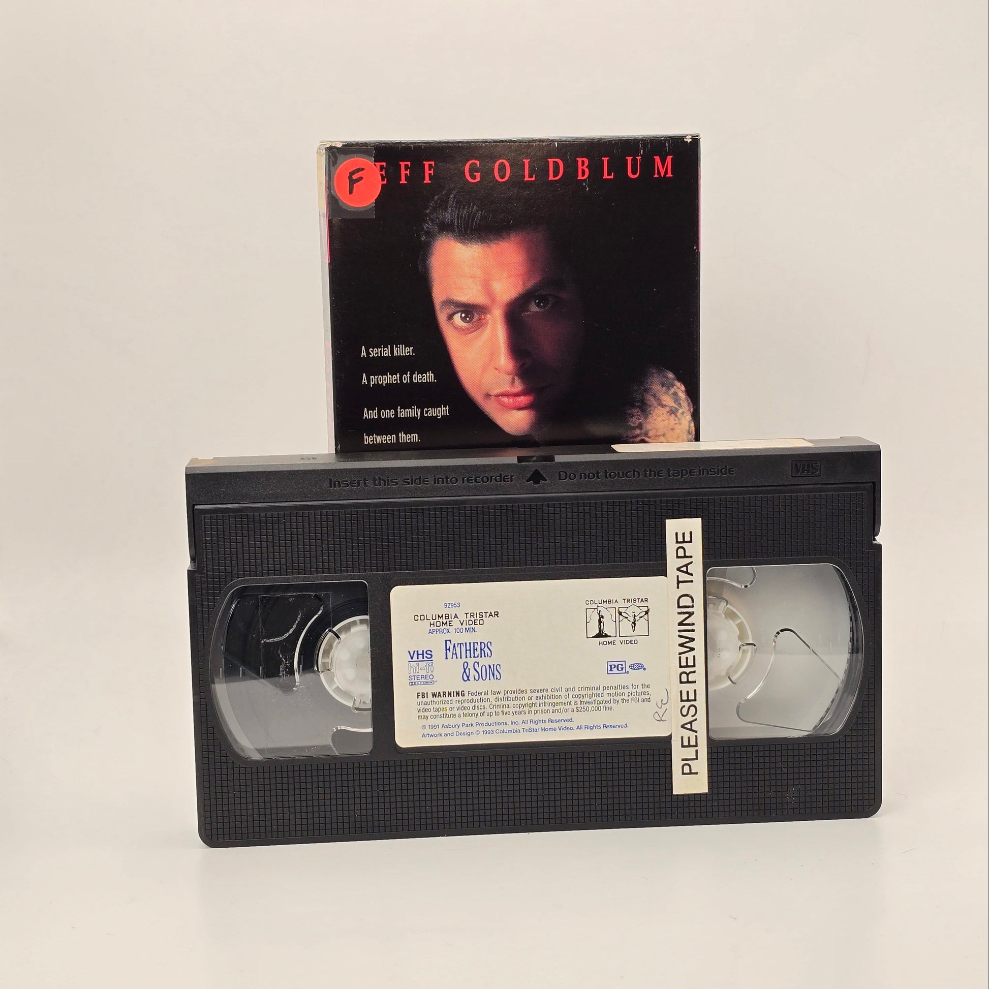 VHS tape with a movie poster featuring a man's face on a white background