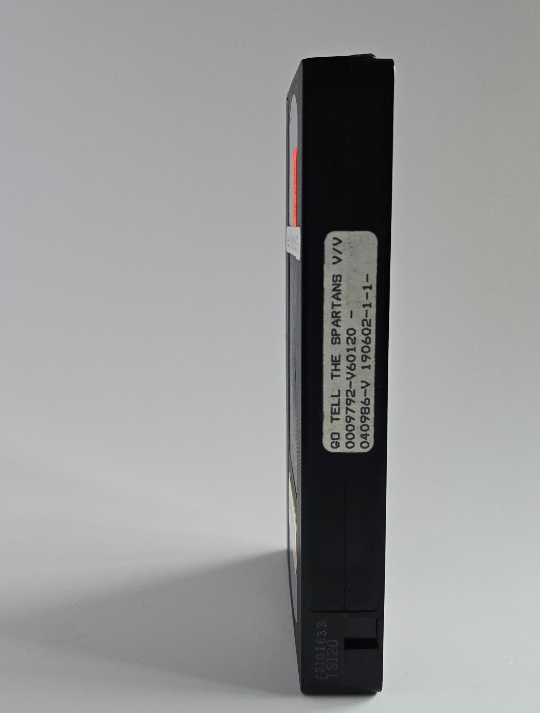 Go Tell the Spartans cassette spine with missing sticker.